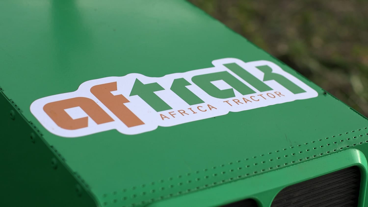 The Aftrak wordmark on the green hood of an AFT-e1, close up